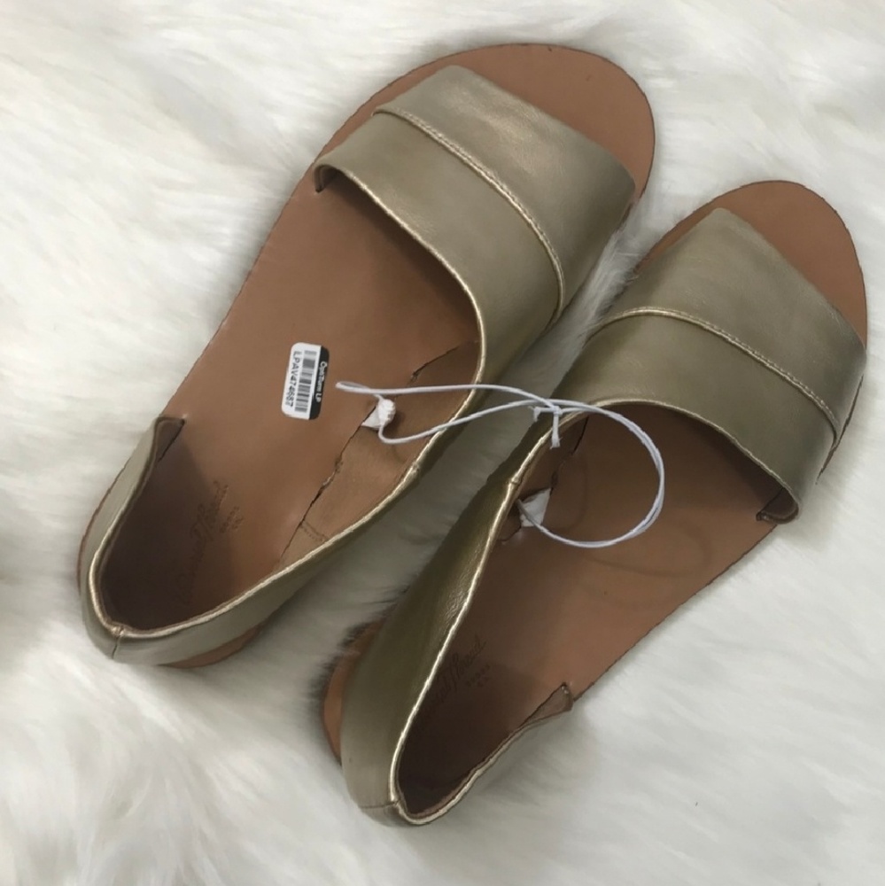 Gold asymmetrical sandals